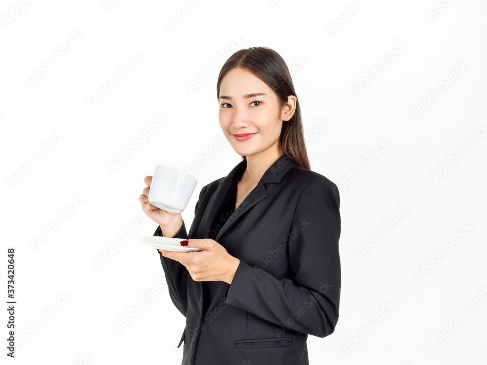 Young Asian smiling businesswoman in suit drinking coffee isolated on white background. Young Asian smiling businesswoman in suit drinking coffee isolated on white background.