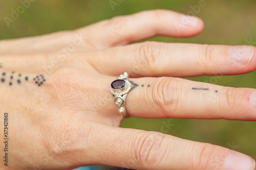 outdoor closeup of female hand with beautiful elegant ring © marbenzu