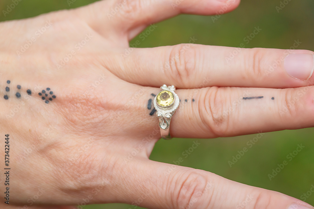 outdoor closeup of female hand with beautiful elegant ring outdoor closeup of female hand with beautiful elegant ring