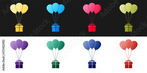 Set Gift box with balloons icon isolated on black and white background. Vector.