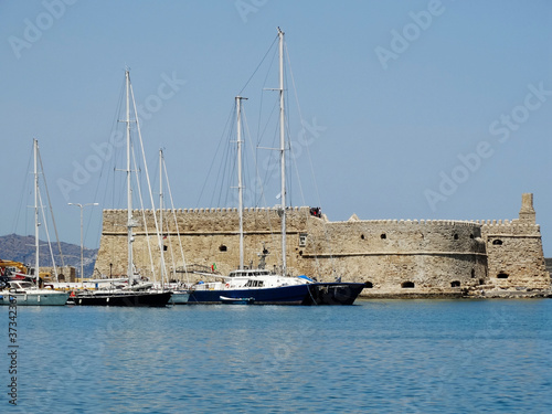 Tourist visit ruins of Fortifications of Chania on Crete Island, Greece. The fortifications of Chania are a series of defensive walls surround the city of Chania in Crete.