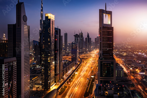 The illuminated, modern skyline of Dubai, UAE, during dusk time