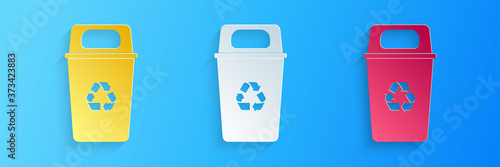 Paper cut Recycle bin with recycle symbol icon isolated on blue background. Trash can icon. Garbage bin sign. Recycle basket sign. Paper art style. Vector.