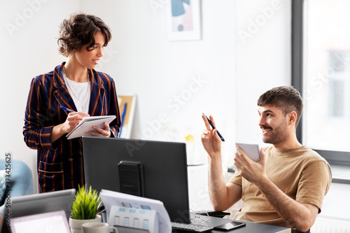 business, people and corporate concept - team of startuppers working at office photo