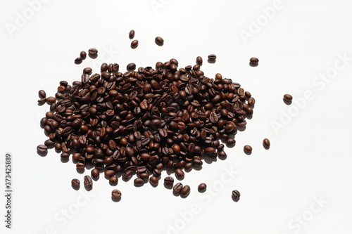 Textured background with arabica coffee beans and robusta closeup. Every day, people drink aromatic strong espresso in the morning. A popular world tradition in every country. Macro view backdrop 