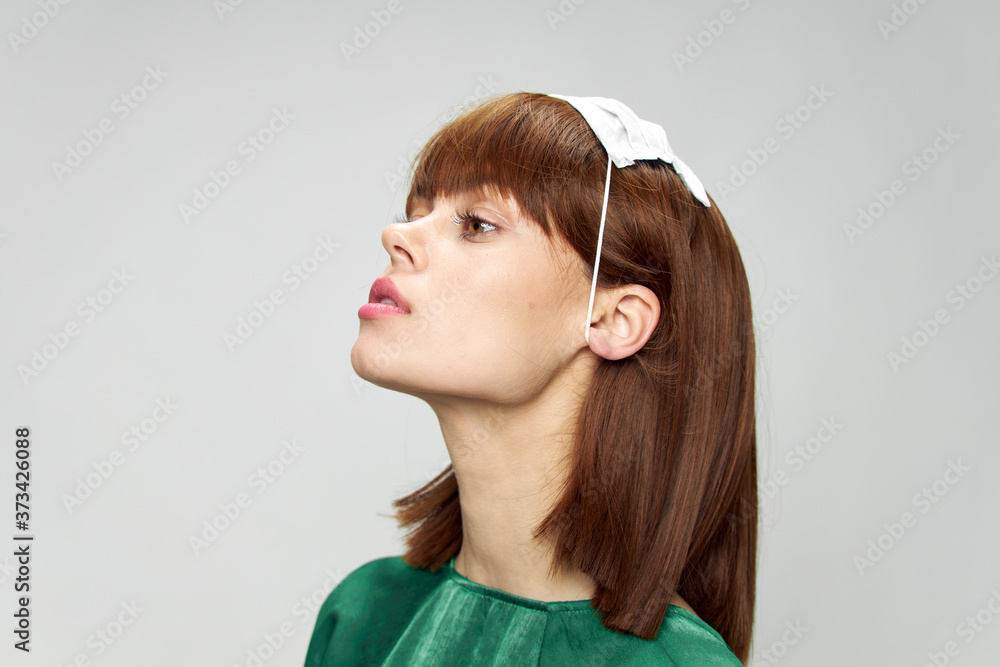 Woman in fashion dress posing in medical mask virus covid-19 Woman in fashion dress posing in medical mask virus covid-19
