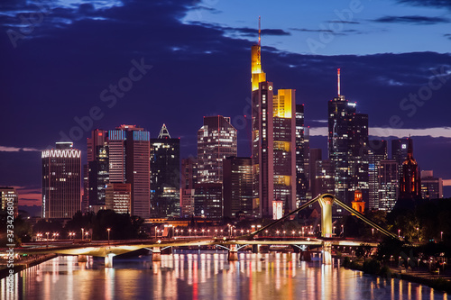 The illuminated skyline of Frankfurt am Main  Germany during the night with skyscrapers