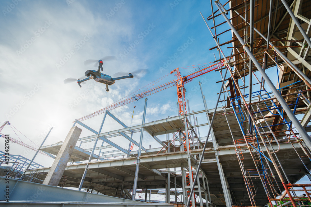 Drone over construction site. video surveillance or industrial inspection. Drone over construction site. video surveillance or industrial inspection.