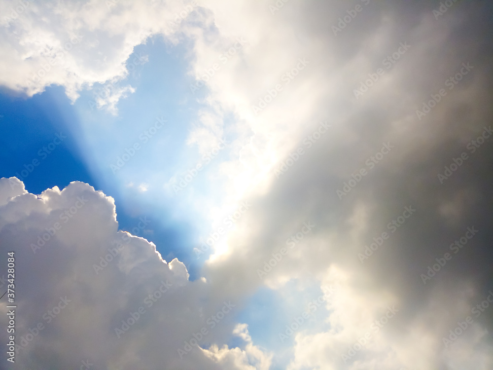 Sky and clouds With a light shining down in the background. Sky and clouds With a light shining down in the background.