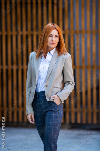 Confident business expert. Happy successful professional posing near office building. European girl. Russian business lady. Female business leader concept. Portrait Of Successful Business Woman