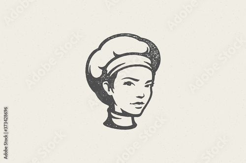 Black silhouette of head of woman in traditional chef cap work in kitchen hand drawn stamp effect vector illustration.