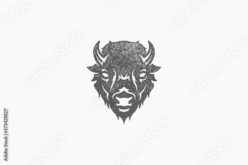 Silhouette of head of wild buffalo or bison as symbol of nature exploration hand drawn stamp effect vector illustration.