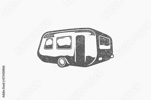 Silhouette of retro trailer designed as emblem road trip in countryside hand drawn stamp effect vector illustration