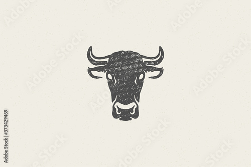 Photographie Black cow head silhouette with horns designed for meat industry hand drawn stamp effect vector illustration