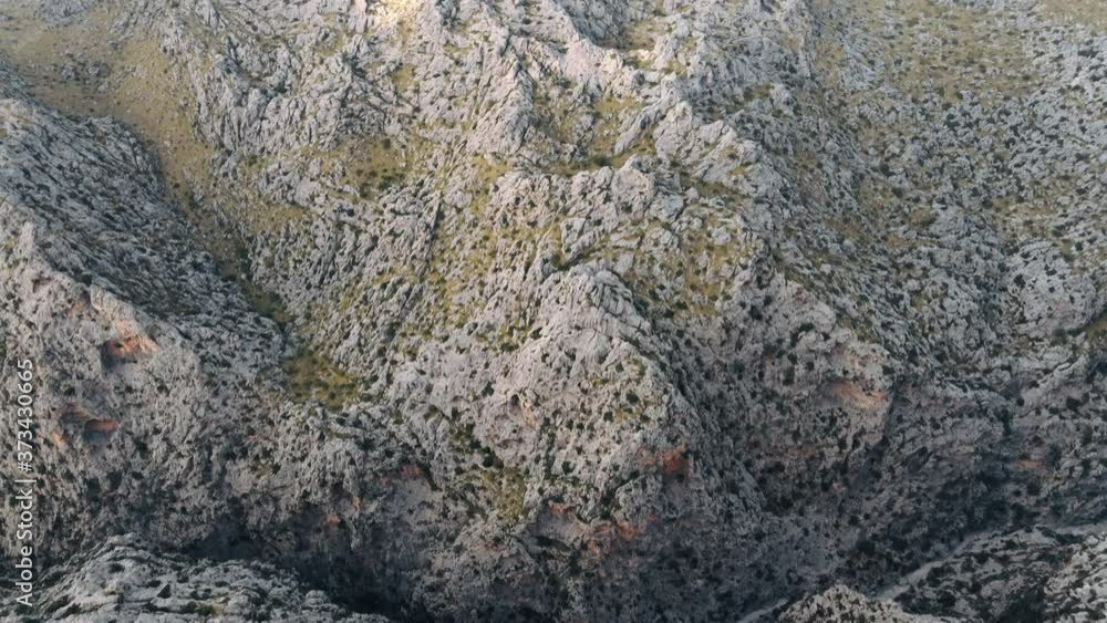 Aerial high angle shot of the rugged landscape of the Serra de Tramuntana range in Mallorca, Spain Aerial high angle shot of the rugged landscape of the Serra de Tramuntana range in Mallorca, Spain