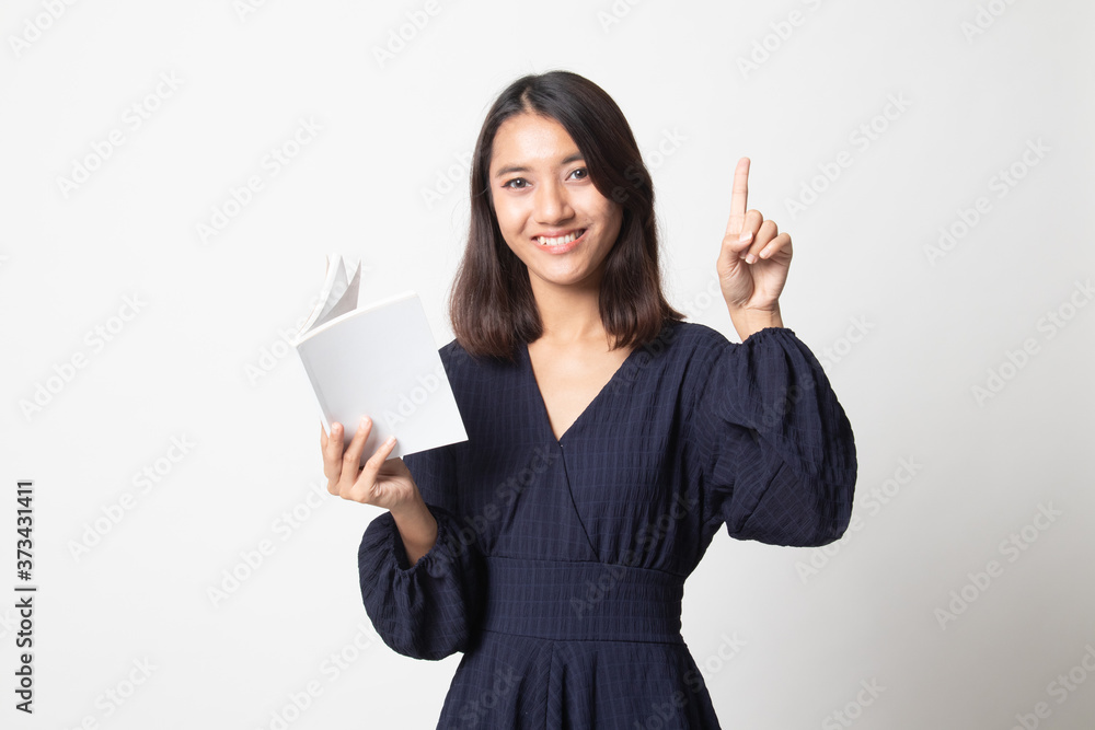 Young Asian woman with a book have an idea. Young Asian woman with a book have an idea.