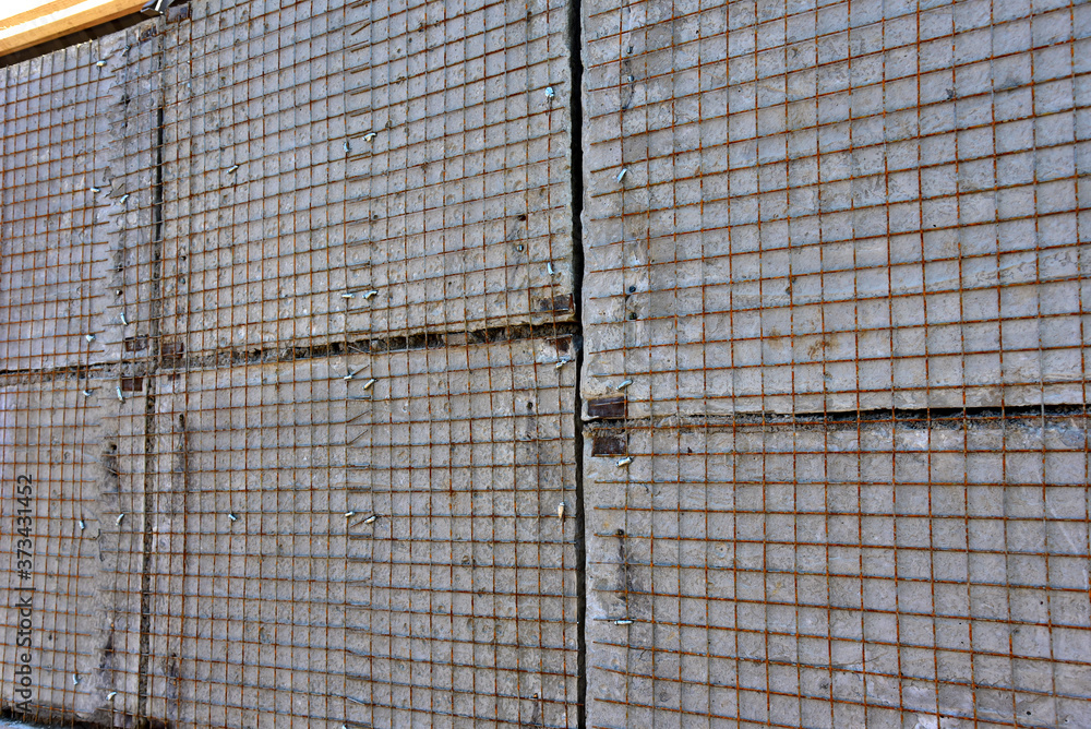 Strengthening of concrete block masonry walls using steel wire mesh