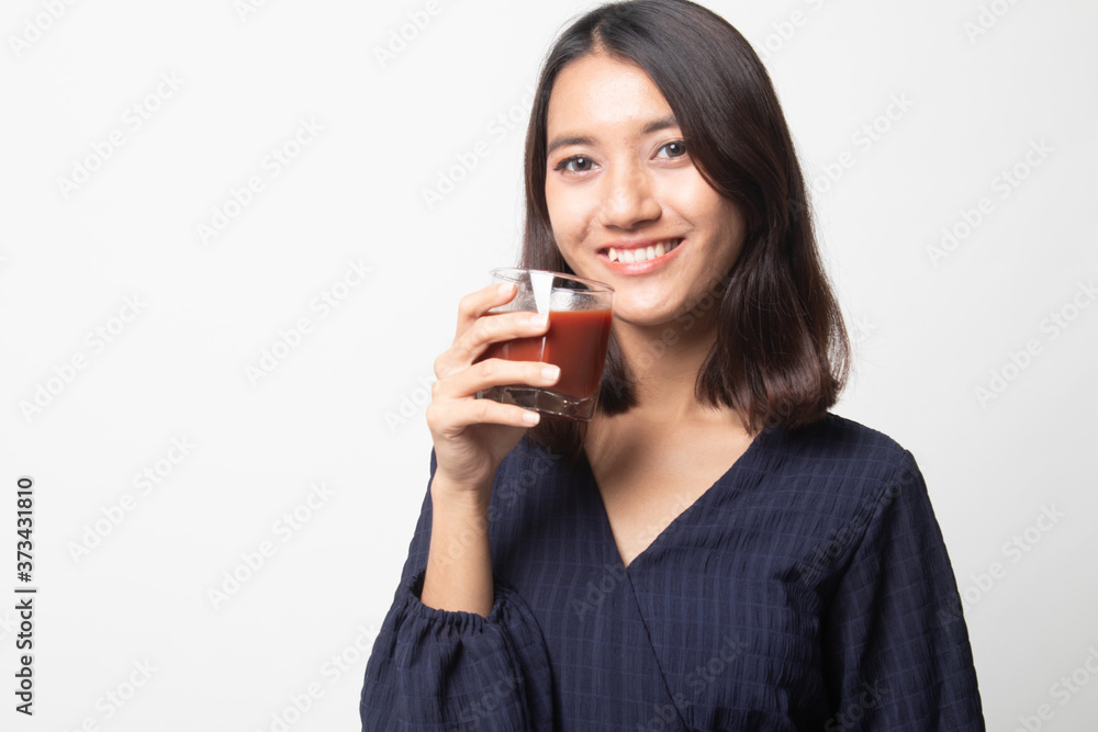 Young Asian woman drink tomato juice. Young Asian woman drink tomato juice.