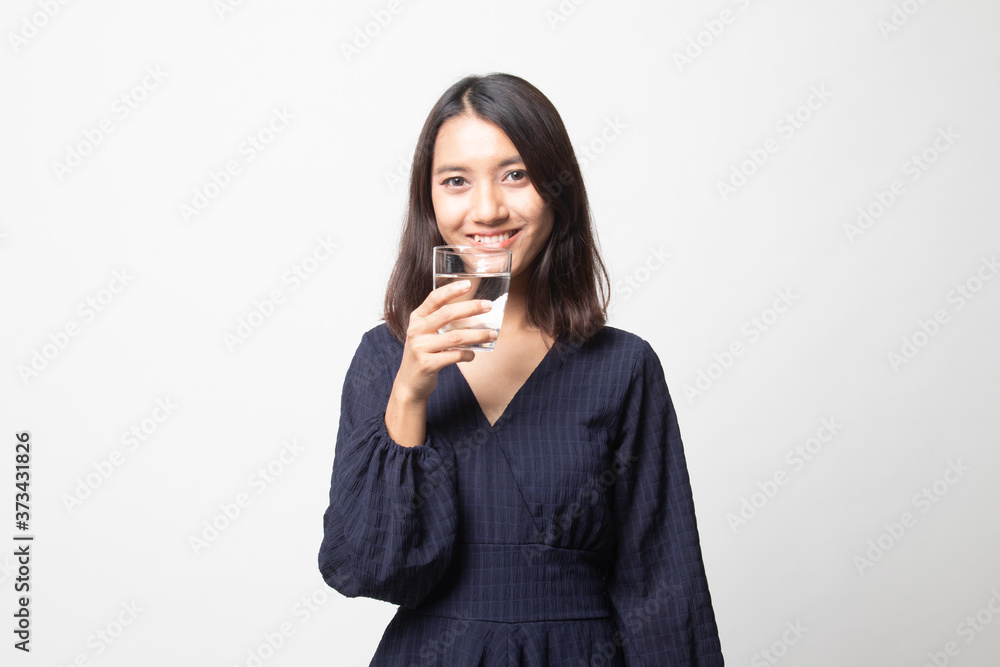 Young Asian woman with a glass of drinking water. Young Asian woman with a glass of drinking water.