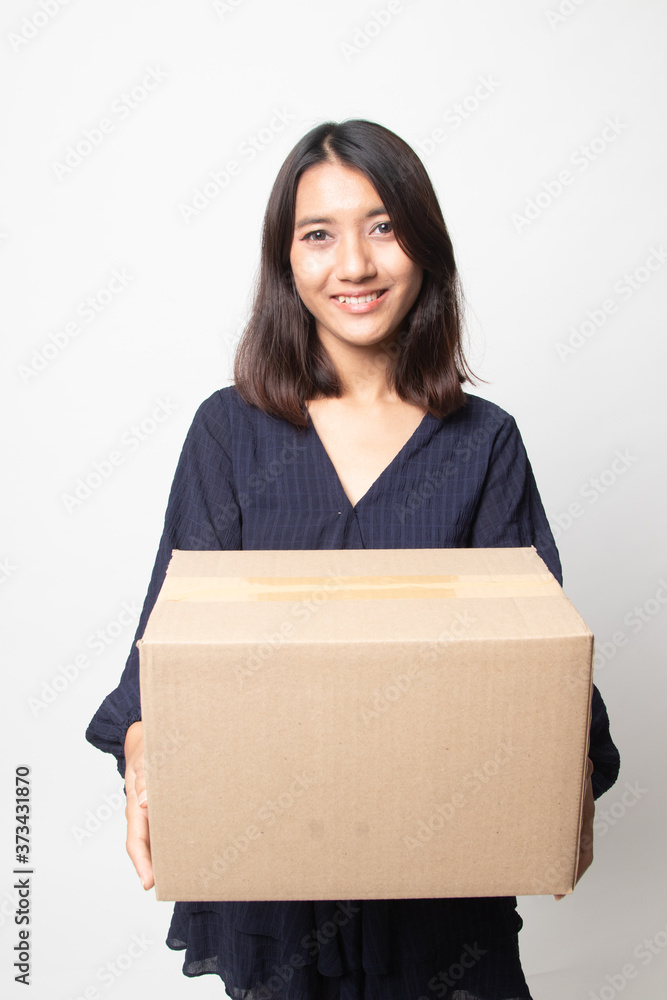 Delivery, relocation and unpacking. young asian woman holding cardboard box. Delivery, relocation and unpacking. young asian woman holding cardboard box.
