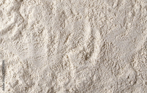 Whole grain barley flour background and texture photo