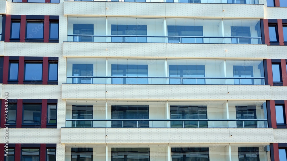 Architectural details of modern apartment building. Modern european residential apartment building complex. Architectural details of modern apartment building. Modern european residential apartment building complex.