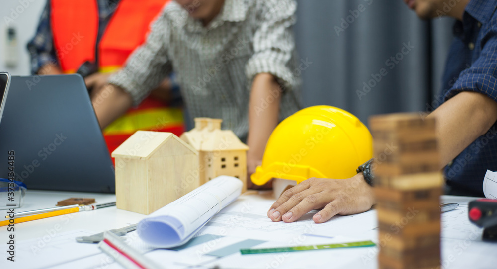Engineers and project assistants work together at their desks in the office. Engineers and project assistants work together at their desks in the office.