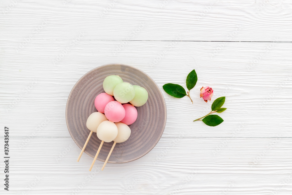 Japanese three colored dumplings Dango on plate, top view Japanese three colored dumplings Dango on plate, top view