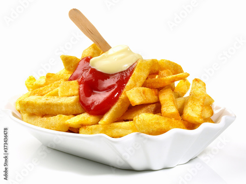 French Fries with Ketchup and Mayonnaise - Fast Food on white Background - Isolated photo