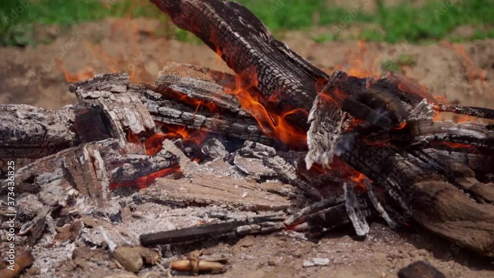 Burning hot sparks rise from large fire in the field Burning hot sparks rise from large fire in the field