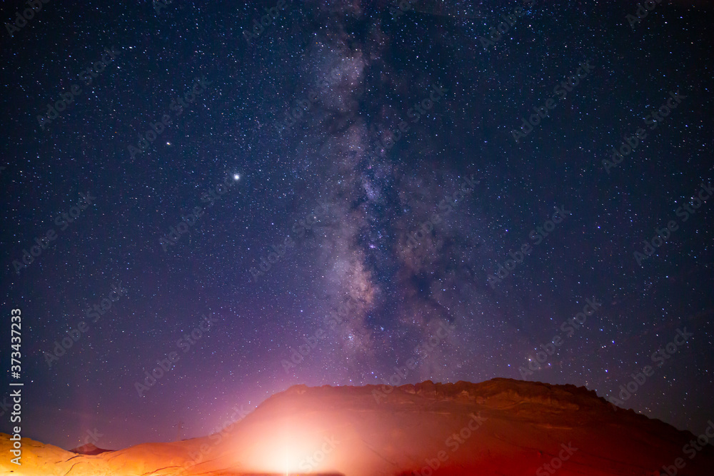 Naklejka premium Deep night sky with bright colorful milky way took with long exposure.