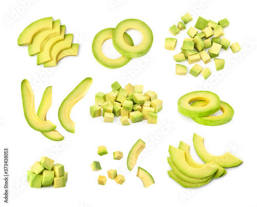 Fototapete set of sliced peeled avocado on a white background