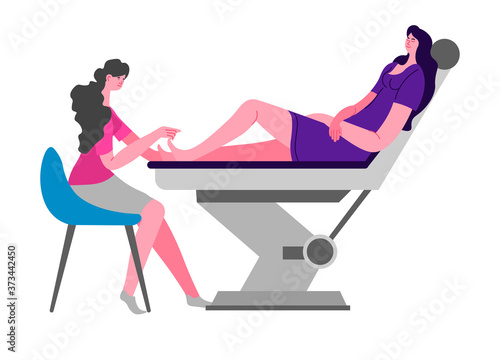 Beauty salon, pedicurist polishes nail of client on pedicure