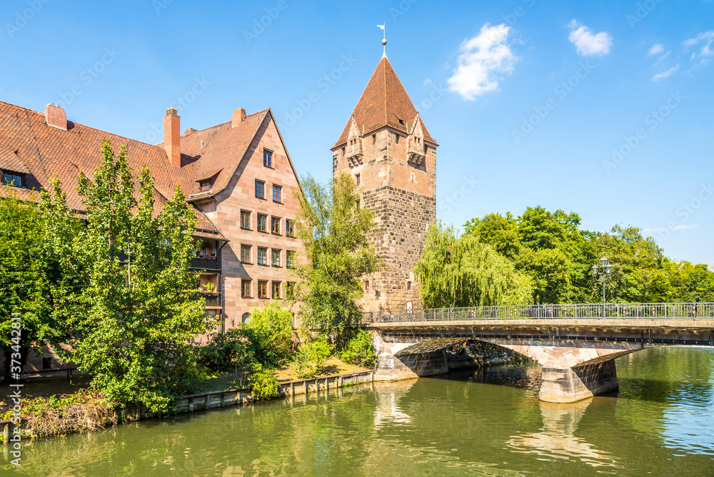 View at the Heubrucke bridge with Schuldturm Tower and Pegnitz river in Nuremberg ,Germany