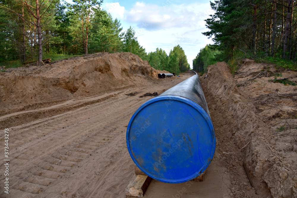 Construction Gas Pipeline Project. Natural Gas and Crude oil Transmission in pipe to LNG plant (shipped by LPG tanker). Building of transit petrochemical pipe in forest area. Pipes Welding Construction Gas Pipeline Project. Natural Gas and Crude oil Transmission in pipe to LNG plant (shipped by LPG tanker). Building of transit petrochemical pipe in forest area. Pipes Welding