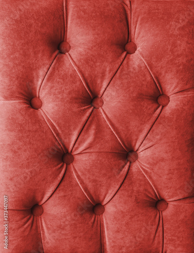 Red capitone velours textile decoration with buttons