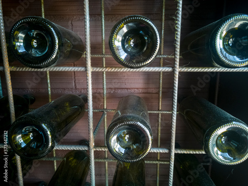 Old Bottles of Wines with Dust in the Cellar