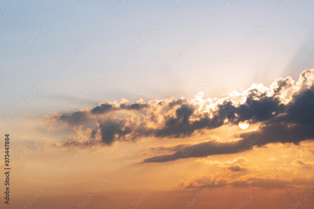 Sunset / sunrise with thunderclouds. Clouds in the rays of sunlight. Sunset Dawn. A natural phenomenon. Weather forecast.