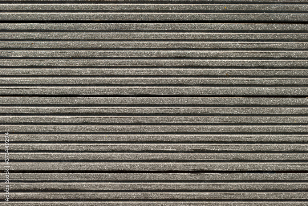 The texture of the gray concrete surface. Concrete bench close up.