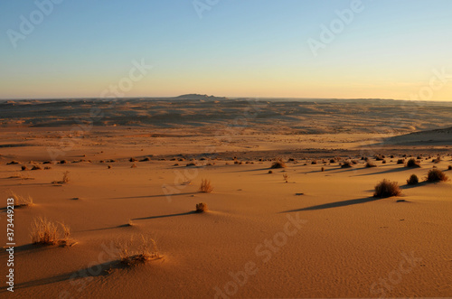 A sunset view over the endless space of the barren Hauchab in the Namib desert