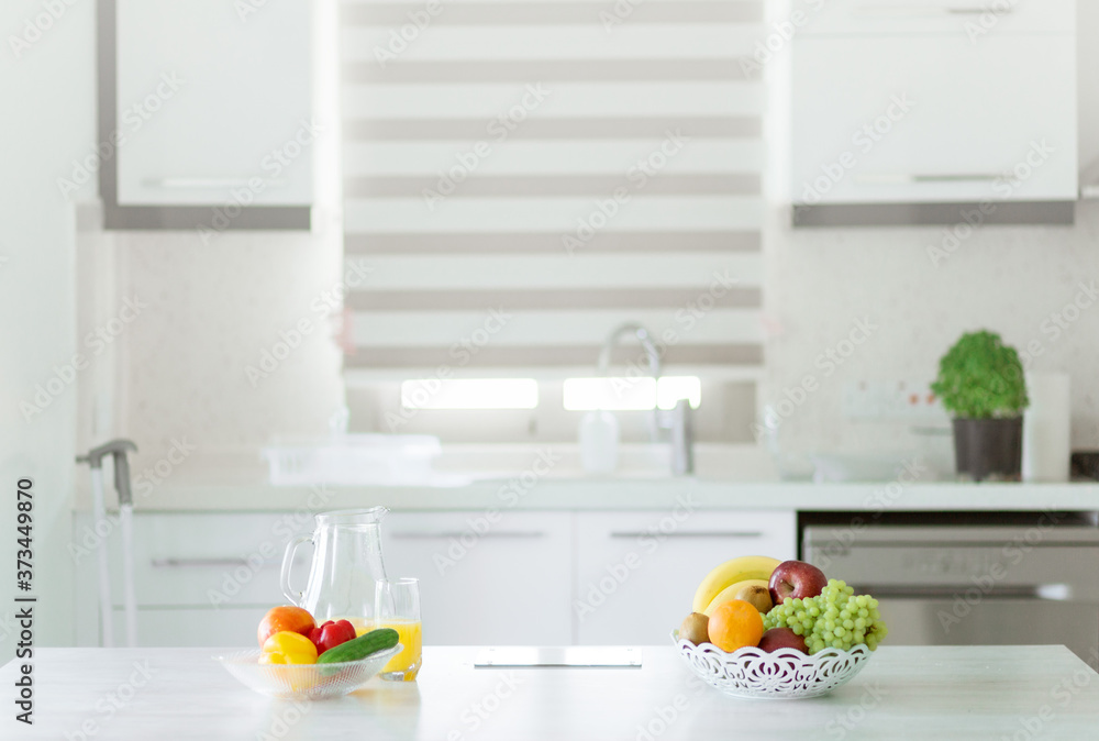 Product bowls on front and blurred view of kitchen interior on background Product bowls on front and blurred view of kitchen interior on background
