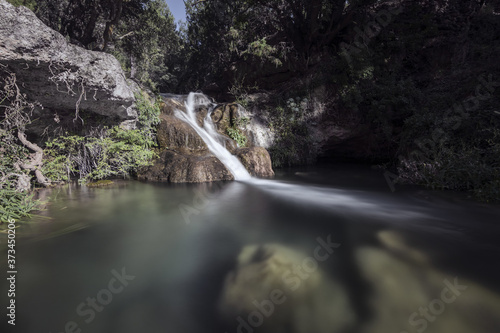 Beautful shot of a waterfall Amanaderos de Riodeva, Spain photo