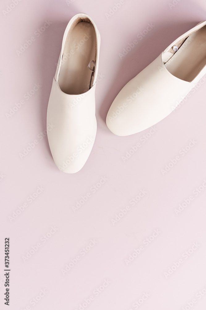 Fashion collage with women's white leather slippers on pink. Flat lay, top view lifestyle concept. Fashion collage with women's white leather slippers on pink. Flat lay, top view lifestyle concept.