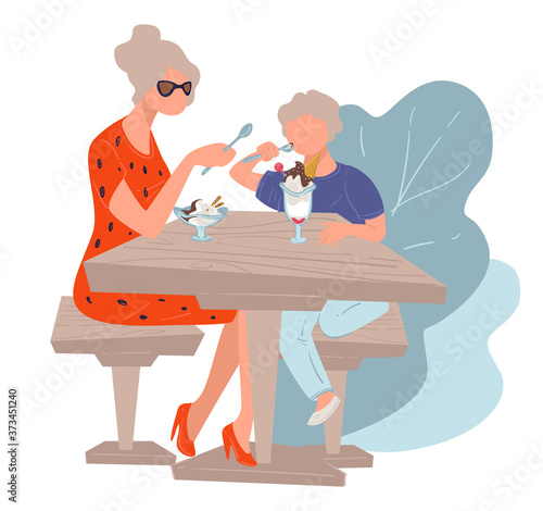 Grandmother and grandson eating ice cream in cafe