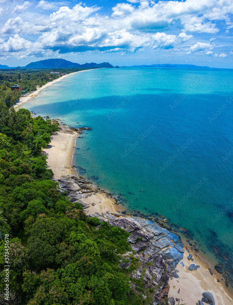 Aerial view image of sea, beache and jungle with blue  sky in Nakhon Si Thammarat, Thailand
