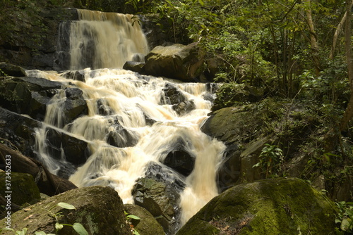 Huai Yai Waterfall after heavy rainfall in deep forest Thap Lan National Park, Thailand. photo