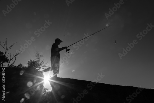 river fisherman with fishing rod