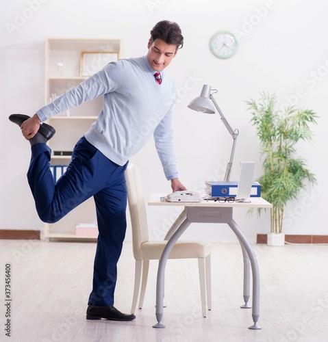 Employee doing stretching exercises in the office