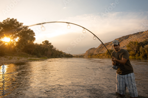 Murais de parede river fisherman with fishing rod
