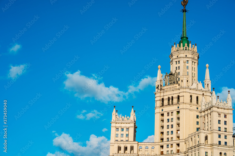 Moscow / Russia - 15 Aug 2020: Panorama of the famous high-rise building in Moscow against the blue sky in Kotelnicheskaya embankment, river walks and tourist season